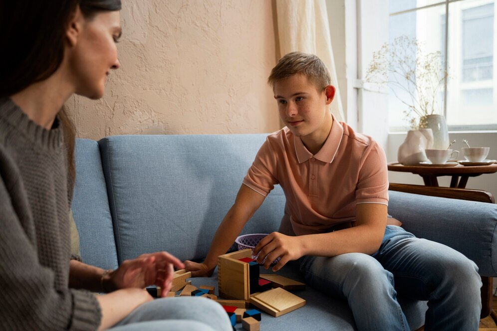 Depressed teenager talking to a counselor
